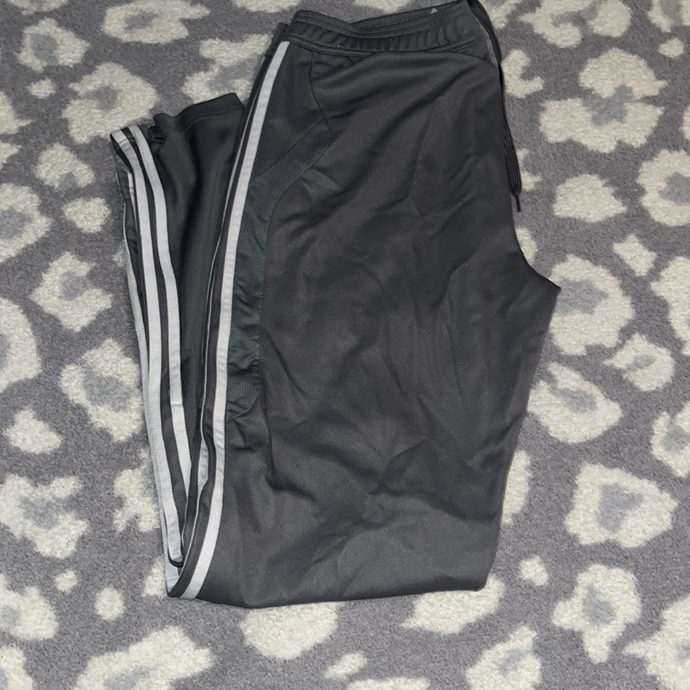 Grey adidas joggers.